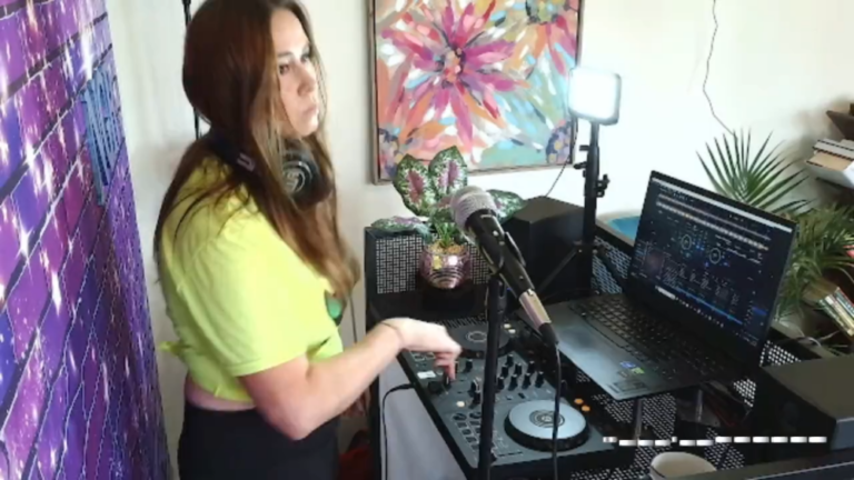 looking out the window practicing house music DJ mixes