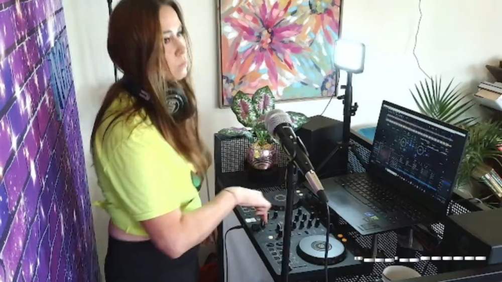 looking out the window practicing house music DJ mixes